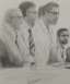 Placeholder: Pencil sketch of Four doctors are discussing ، on lined paper