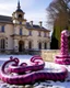 Placeholder: A magenta snowy castle with snake statues designed in Bayeux tapestry painted by Giovanni Battista Sassi