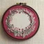 Placeholder: exquisite whimsical in embroidery hoop, intricate, highly detailed, linen and wood backdrop