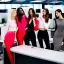 Placeholder: photo of 3 beautiful models wearing high fashion clothes posing and smiling on the dow jones trading floor, bankers busy working in the background, big smile, balenciaga, yeezy season, photorealistic photography, colourful, high contrast, in an office, dow jones, trading floor, fashion photography, high resolution, 8k, moody, hard light, gen z, wide angle lens