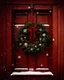 Placeholder: A festive wreath hanging on a wooden door surrounded by falling snowflakes