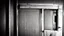 Placeholder: unhinged door, anime, monochrome, black background, ink, simple, maximum quality, broken hinge, barely functioning, why is it still being used it's a health hazard