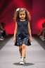 Placeholder: 2 years old baby girl fashion model with curvy wavy hair ,cat walks in runway,catwalk and pose at end with cute