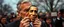 Placeholder: pin hole cam, bush holding an obama mask