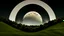 Placeholder: giant virtual moon, maximum quality, centered on frame, far view, in the middle of a grassy hill, white sky with cumulonimbus