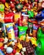 Placeholder: An image full of soda, chocolate, fruit juice, fruit pieces, and various types of chocolate from global brands, along with chips, puffs, biscuits, shampoo, and detergents, in a psychedelic, colorful, and eye-catching atmosphere.