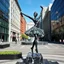 Placeholder: photo of a statue of ballerina made of black marbel in a modern city center