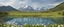 Placeholder: Spring,a lake in the distance, mountains, panorama