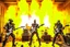 Placeholder: A hard rock band made up of Terminators performs in a burning building.