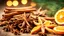 Placeholder: Traditional Christmas spices and dried orange slices on holiday bokeh background with defocus lights. Cinnamon sticks, star anise, pine cones and cloves. Christmas Spices Decoration