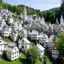 Placeholder: A white village in the sky designed in German folk art