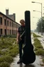 Placeholder: a very disappointed member with guitar case of a hard rock band who has been kicked out of a rehearsal space in Sweden, old factories style with bricks, deserted place overgrown plants and grass, he stands outside in the rain and cries, street lamps shining, raindrops, wind, empty roads and cycle paths next to it