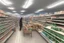 Placeholder: can you please generate an image of supermarket in a refugee camp that sells imported goods like clothes, bottled water, cleaning products ect