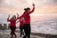 Placeholder: a group of Turkish young ladys in sports pants and blouse are dancing in Babak Castle in Iran west north ,cloudy sun set sky,snowy environment