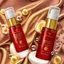 Placeholder: two cosmetics bottles are on a silk fabric, behind a beautiful floral spring floral background, the picture is top view, in the background there are beautiful soap bubbles, molecules and honeycombs, high-quality picture, top view