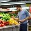 Placeholder: Men buying a very healthy fruit and vegetables in a supermarket