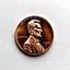 Placeholder: photography of a 1966 Copper Penny but with a zombie that resembles Lincoln, text "1966", text "IN NONE WE TRUST", horror, surreal, dark negative space, macabre