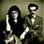 Placeholder: Awkward portrait Photo with a man and a woman with ugly glasses, 30 years old sitting on chair, serious look, long 1960 hair and mustasch, polaroid camera photo, holding small cats