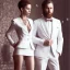 Placeholder: 8K, a Highly detailed stunning image of Dom man with a submissive woman, woman pose Nadu, a white suit, beard, and short hair,