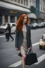 Placeholder: slim redhead woman walking across a busy street