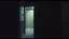 Placeholder: motel door slightly open, dim light inside, empty room, grainy candid photograph, documentary style