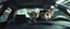 Placeholder: extreme close up on cheeky fluffy weasel cowboy elf family scumbag in the car in the style of Escher and Giger and Fallout 4, pinhole cam, airbrush 3d rendering, on tv screen:A five-second cinematic single take in a clean industrial presentation hall.