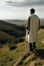 Placeholder: A person in Andalusian clothing standing on a hill with his back