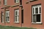 Placeholder: distant large single estate ward many windows, distant schoolhouse at 3/4 angle, large windows, estate, realistic photograph