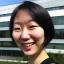 Placeholder: A short haired, Japanese female software engineer taking a selfie in front of Building 92 at Microsoft in Redmond, Washington