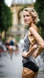 Placeholder: beautiful anorexic young woman, total shot, grey triathlon swimsuit, short blonde wavy bob hair, blurred city background