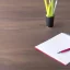 Placeholder: nglish proofreading paper on table in office with office supplies