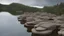 Placeholder: aerie made of rock reaching hundreds of feet into the sky, in a lake