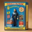 Placeholder: A photograph of a pristine action figure encased in its packaging, evoking a sense of collectible wonder, styled after a vintage toy advertisement. The box prominently displays "Writer" in bold, stylized lettering, with the action figure inside clearly resembling Charles Bukowski as a Dharma Bum, possessing his iconic features confidently with a book and a bottle
