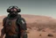 Placeholder: A Bald space marine with green eyes and a thick black beard, wearing Desert Camouflage and a rebreather mask standing looking out upon a desert planet