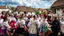 Placeholder: hungarian village wedding, group of women dancing in authentic Hungarian sárköz colorful folk dress with flowers shapes , high realistic, high qulity, detailed, happy, stunning, perfect photo