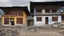 Placeholder: Houses in Kuruthang, Bhutan, traditional style, Bhutanese penis mural, beautiful composition, award-winning photograph, astonishing realism