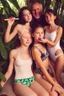 Placeholder: two young natural teenage girls with dad in a swimsuit in a bed in the jungle. eating a lollypop. cute. sharing icypole. icecream on face. old man