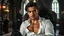 Placeholder: A breathtaking cinematic portrait of a handsome, muscular man around 35 years old sitting confidently in an elegant Victorian armchair inside a dark Gothic castle room. He has medium-length dark hair, dark eyes, subtle stubble, and an intense, determined gaze looking directly into the camera. His white shirt is partially unbuttoned, revealing part of his chest, with fitted black leather trousers, Gothic room. in background a blur vampire voman stands, detalied, cinematic