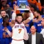 Placeholder: Jalen Brunson winning the NBA finals with the new york Knicks at Madison Square Garden and holding the MVP trophy above his head