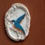 Placeholder: ivory brooch of a kingfisher, decorative design, classical ornament, highly ornate, highly intricate, highly detailed etching, marble carving, warm lighting, linen and wood backdrop