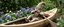 Placeholder: wooden garden troll in wooden kayak