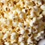 Placeholder: A bowl of popcorn with individual popped popcorn having the faces of Barack Obama and Nancy Pelosi