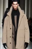 Placeholder: Men's winter fashion runway, super designer inspired by Superman style with the main emblem as the concept of the whole style beige tones