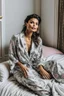 Placeholder: a supermodel in designer sleepwear sitting on bed for magazine cover photoshoot