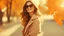 Placeholder: Fashion Portrait of a beautiful smiling young woman in sunglasses over orange background. Autumn, fall woman.