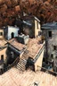 Placeholder: detailed view of city roofs and terraces at a moonlit night in collage