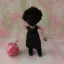 Placeholder: Black doll