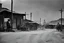 Placeholder: [very impressive high res masterpiece in Kodak Eastman 5247, scene by László Krasznahorkai] the Black or Afro-American sheriff in the Wild West. A tale as rare and powerful as a shooting star in the night sky. Picture this: a lone figure, standing tall in the dusty streets of a frontier town, a badge gleaming on their chest, defying the odds and challenging the stereotypes of the time.