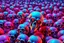 Placeholder: a field of 1000s of cartoonish, anatomically correct, skulls, vivid RANDOM BRIGHT neon colors, dark comedy, well lit, high detail, photorealistic, horrorcore, fun, scary, none featured, each a different color or hue,