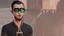 Placeholder: a single man, an Arab from the Middle East, he has a beard, who wears a gold chain, with a t-shirt marked ODK, wears a black baseball jacket with the mark ODK, which bears black sunglasses, with a black baseball cap with the initials branded ODK. at night, in the city center, at night.